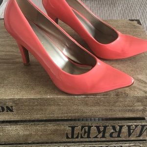 Bright orange/salmon colored high heels